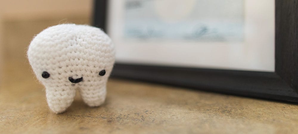 Small doll of a tooth